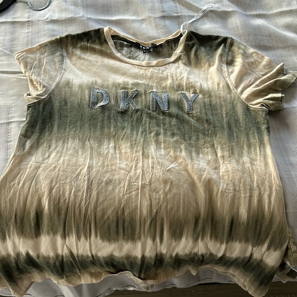 Tye dye DKNY t shirt wider on bottom of shirt.